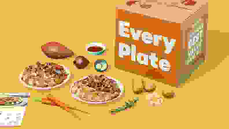 EveryPlate box with ingredients and menu cards in front