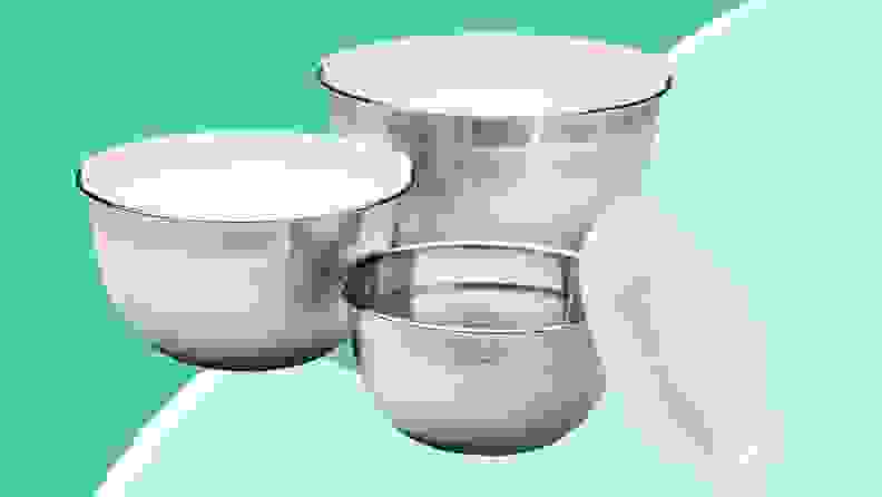 Cuisinart mixing bowls on a green background.