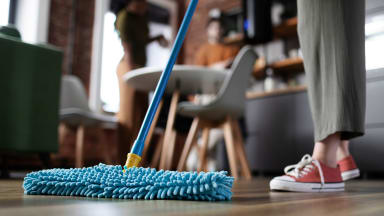 A person mopping the floor.