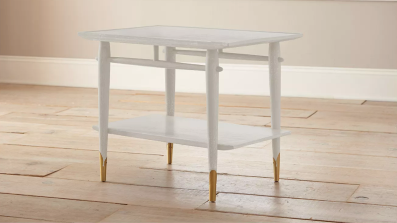 Chalk-style paint from Magnolia Home by Joanna Gaines is a hot seller at Target, since DIYers use it to refurbish unique furniture pieces, like this table, and add modern hardware.