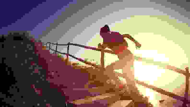 A woman running up the stairs next to the sun