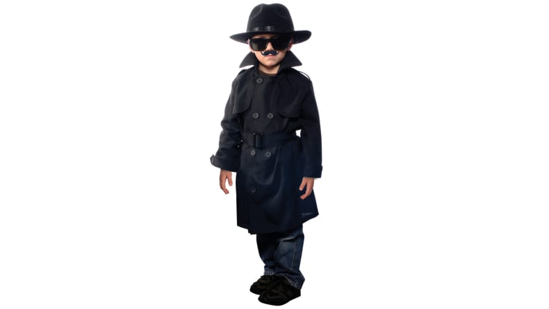 Young child wearing as a spy with black trench coat, hat and sunglasses.