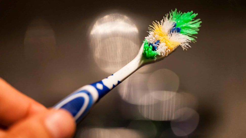 An old toothbrush that needs to be replaced