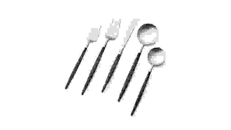 A set of stainless steel flatware with sleek, slim black handles.