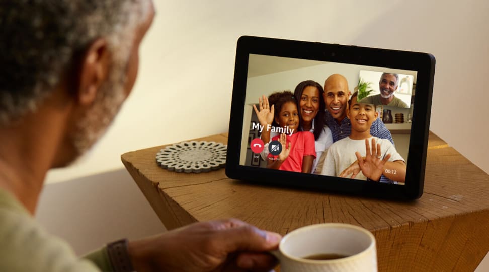 A man chats with a group of people using an Amazon Echo Show (second-generation)