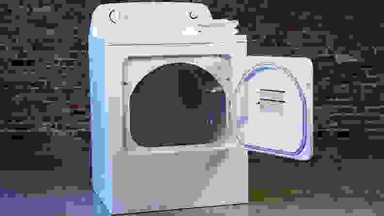 The Kenmore dryer against a brick wall.