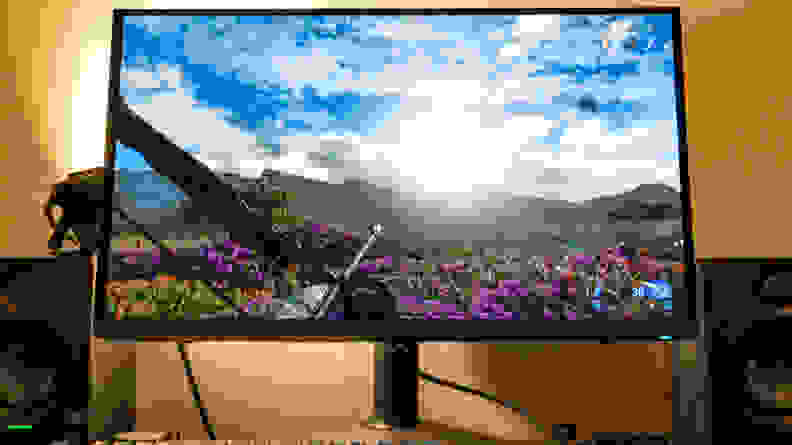 A gaming monitor with Pandora on screen and the sun