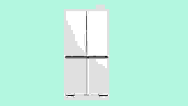 A white Samsung refrigerator against a light blue background.
