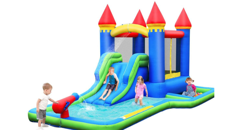 Kids playing on multi-colored Bountech inflatable castle water slide and bounce house.