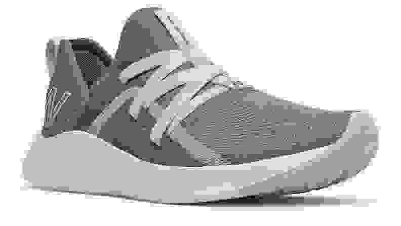 A gray and blue New Balance Beaya shoe against a white background.