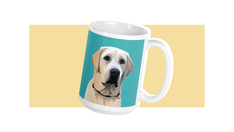 A white coffee mug with a portrait of a yellow lab against a teal background, all against a light gold background.