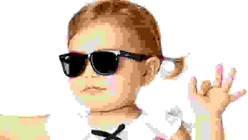 A young girl wears Wayfarer-style sunglasses
