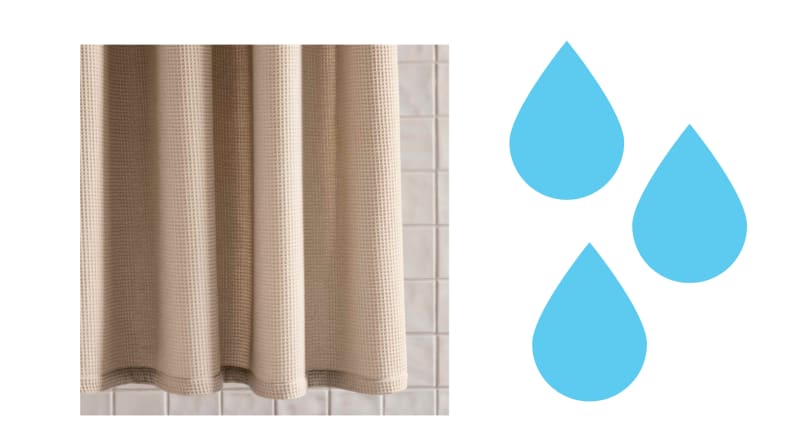 A beige shower curtain in a bathroom