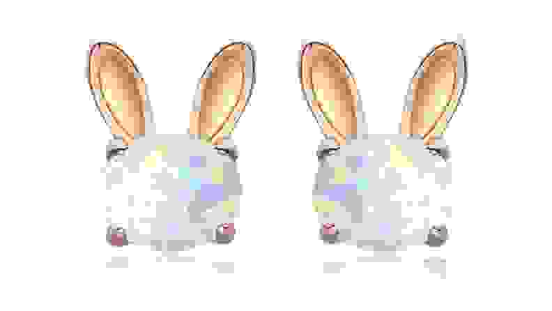 Gold bunny-shaped earrings with shimmering opal centers.