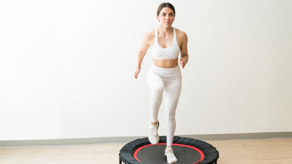 A woman jumping on a rebounder.