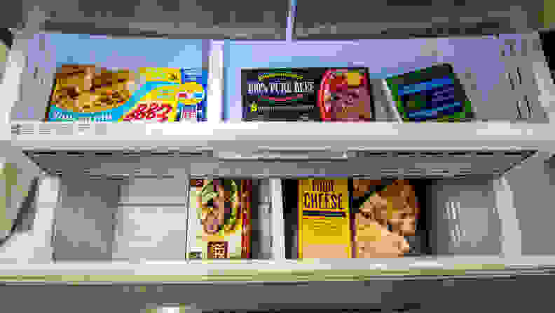 Two of the RF28R6201SR's freezer drawers are open, displaying some food items.