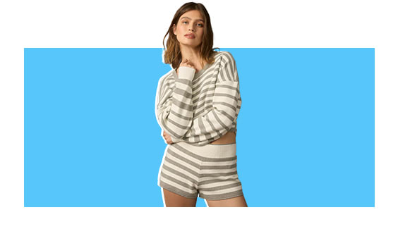 A model wearing a matching striped pajama set.