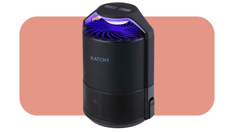 Product shot of the Katchy Indoor Insect Trap with blue UV shining on top in front of pink background.