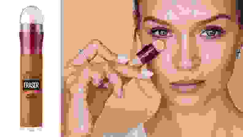 On the left: The Maybelline Instant Age Rewind Eraser Multi-Use Concealer in a tan-deep shade on a white background. On the right: A person with fair skin holds the Maybelline concealer up to their under-eyes and looks at the camera.