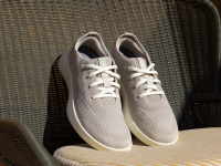 grey sneakers on patio chair