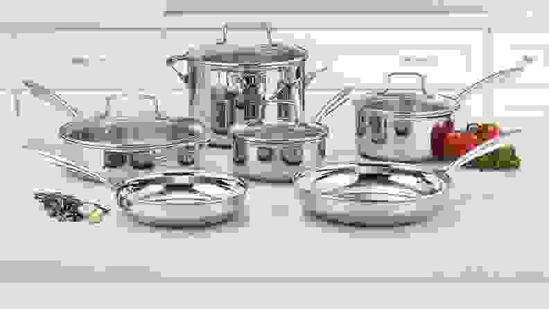 Silver cooking set on countertop in kitchen.