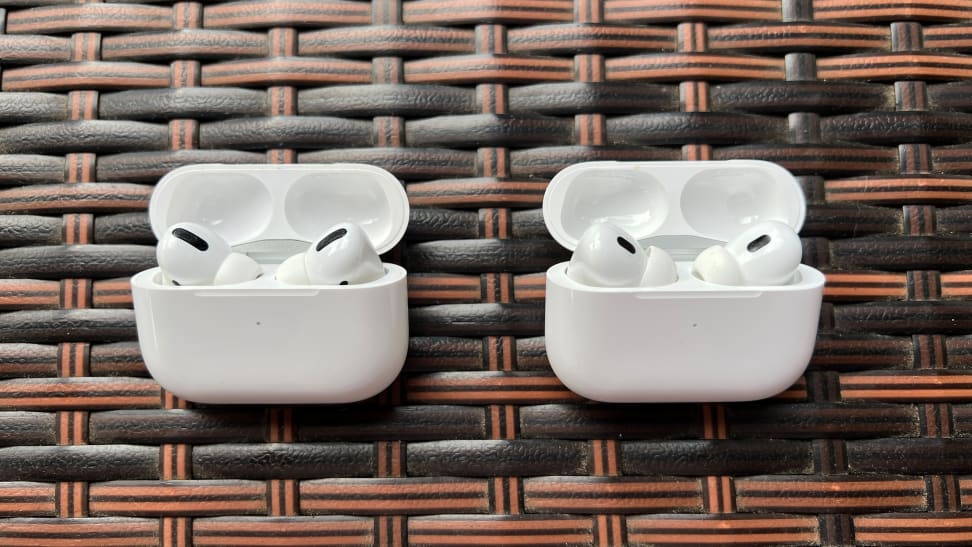 The white AirPods Pro case sits open next to the very similar AirPods Pro (2nd gen) case