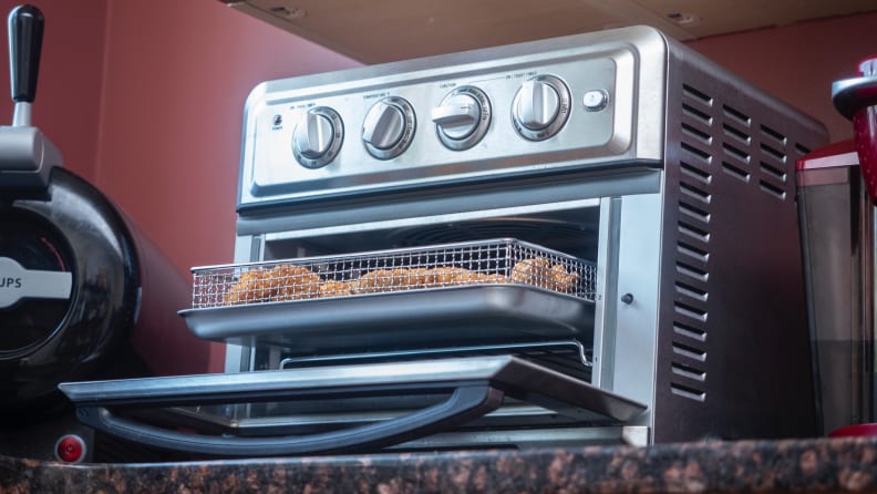 Cuisinart Air Fryer Toaster Oven sits on a kitchen counter.
