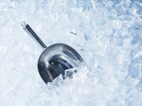 Close up photo of ice with scooper.