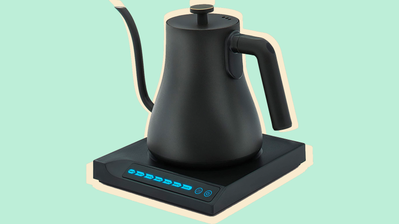 Electric kettle on a green background
