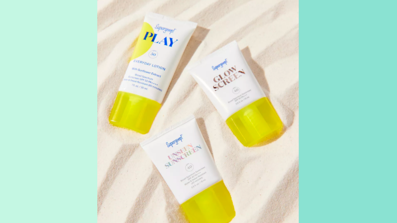 An image of three individual small bottles of Goop sunscreen, including the Unseen sunscreen, the Play lotion, and the Glow Screen sunscreen.