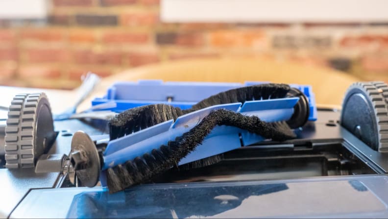 The brush roll of the Eufy G30 being replaced.