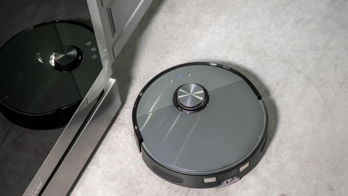The Ultenic MC1 robot vacuum cleaning a kitchen floor.