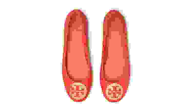 Red shoes with iconic Tory Burch golden toe medallion