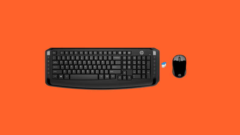An image of a black keyboard seen from above, alongside a small computer mouse and a USB chip.