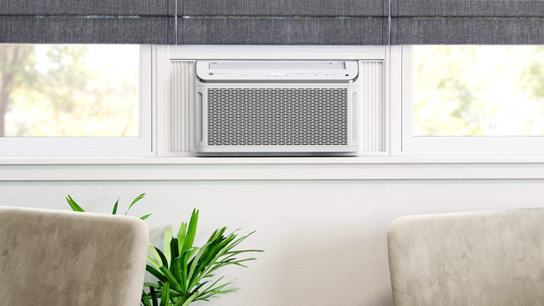 Air conditioner unit in window at home.