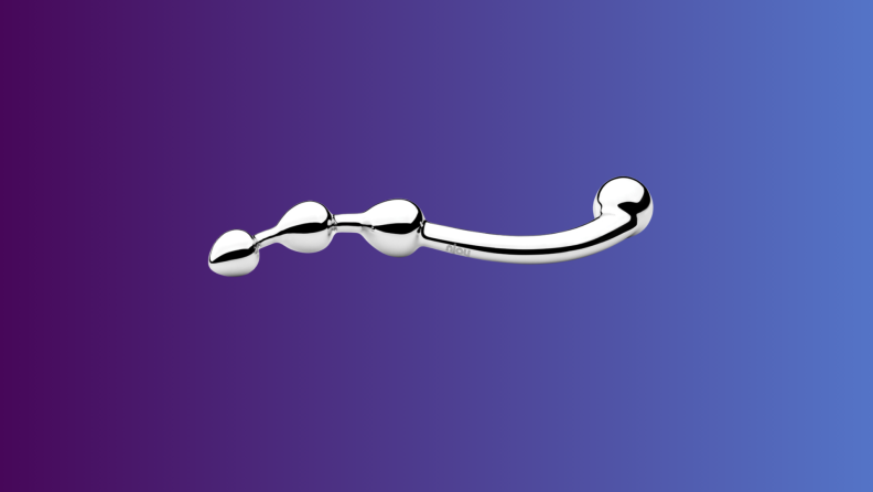 An anal sex toy sits on an indigo fade background