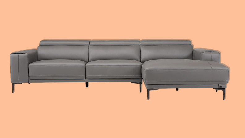 Zuri Furniture Rousso leather sectional on orange background.