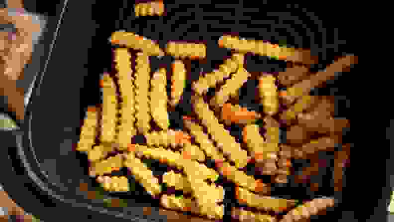 A serving of crinkle French fries in the Cosori TurboBlaze basket.