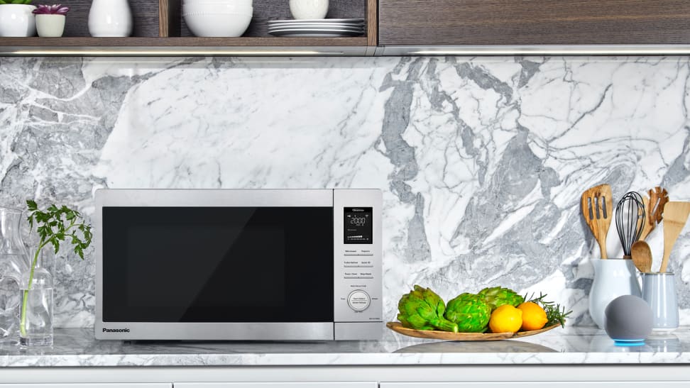 Panasonic's first smart microwave sitting on a kitchen counter with a marble backsplash