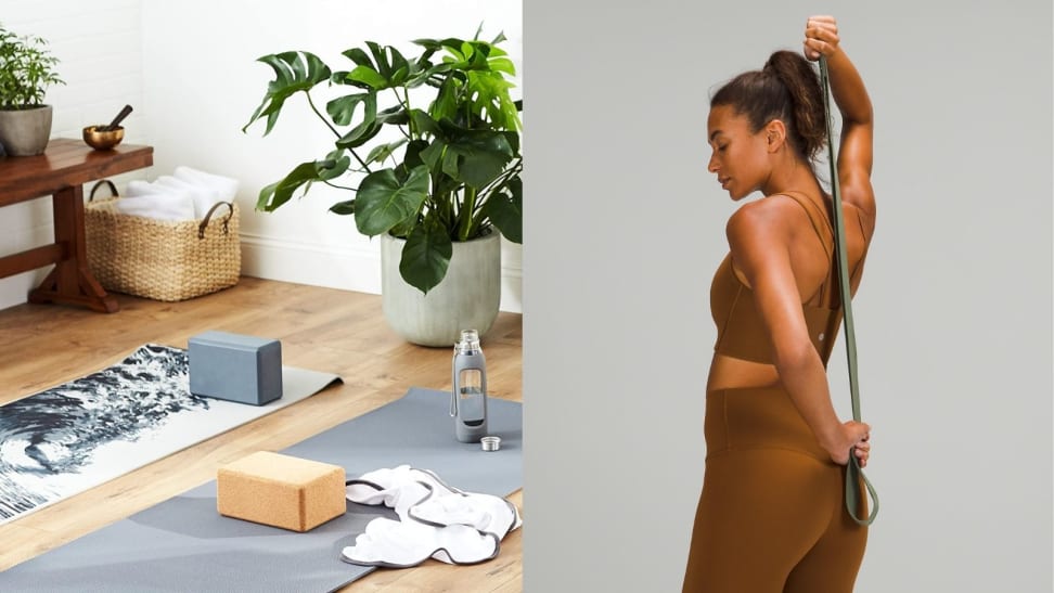 yoga blocks atop yoga mats and a woman using a yoga strap behind her back