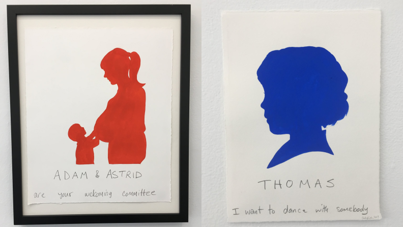 A red painting of a pregnant mom and child and a blue silhouette of a child