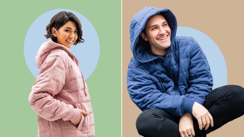 On left, model smiles and poses in plush, pink weighted hoodie with one hand in pocket. On right, model smiles and sits with legs crossed while wearing blue weighted hoodie.