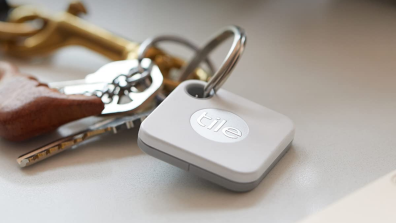 A Tile device attached to a keychain.