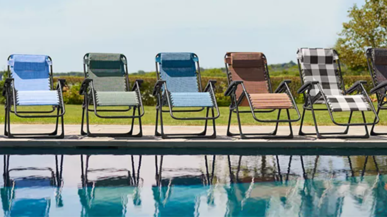 Multi-colored Kohl’s Sonoma Goods For Life regular antigravity chairs lined up on pool deck.