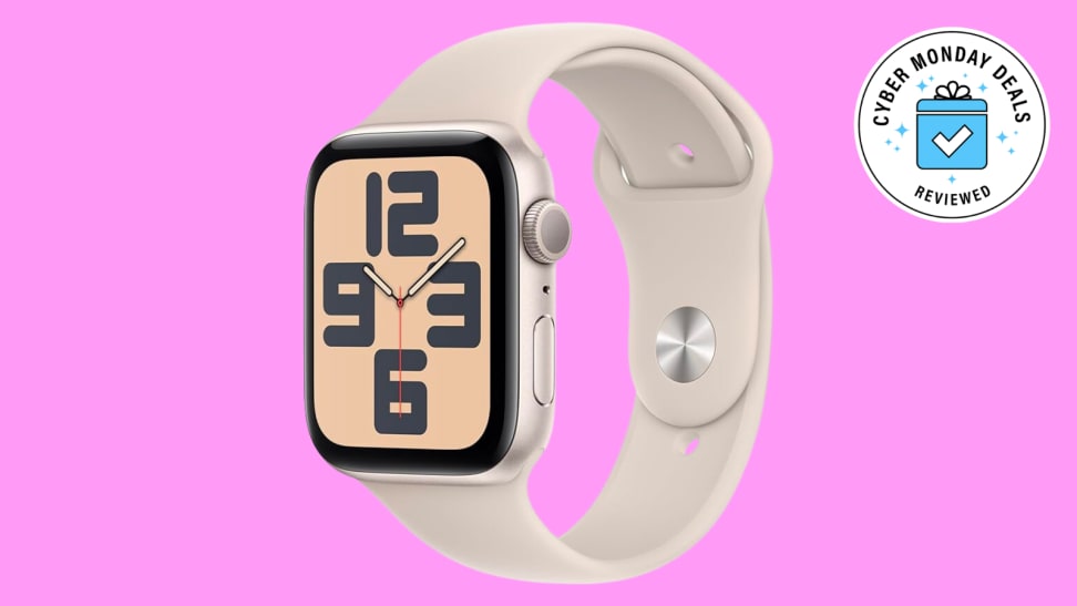 A cream-banded Apple watch on a pink background