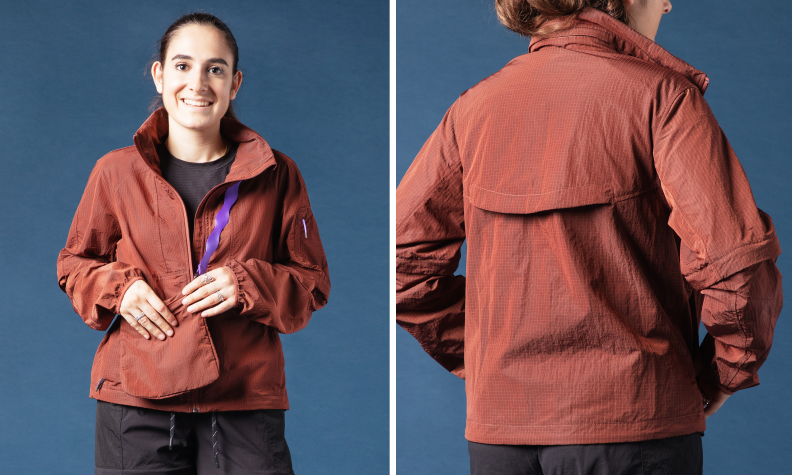 A woman wearing a Lululemon Hike jacket. The jacket is a reddish brown.