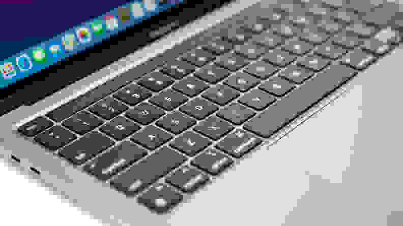 Close-up of a MacBook laptop's keyboard: flat, smooth black keys in an aluminum chassis.