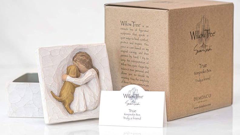 An image of a Willow Tree keepsake placard featuring a little girl holding a dog.