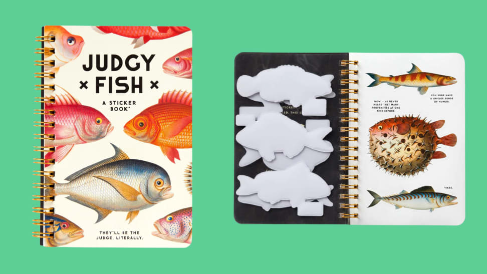 The "Judgy Fish" spiral bound sticker book cover, next to an open page of stickers against a green background.