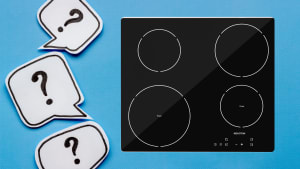 Question mark bubbles surround an induction stovetop on a blue background